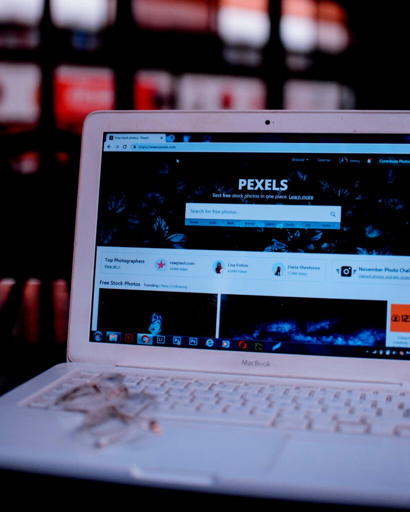 pexels-photo-1590086-1590086 Laptop on a desk showing the Pexels homepage, highlighting its web interface.